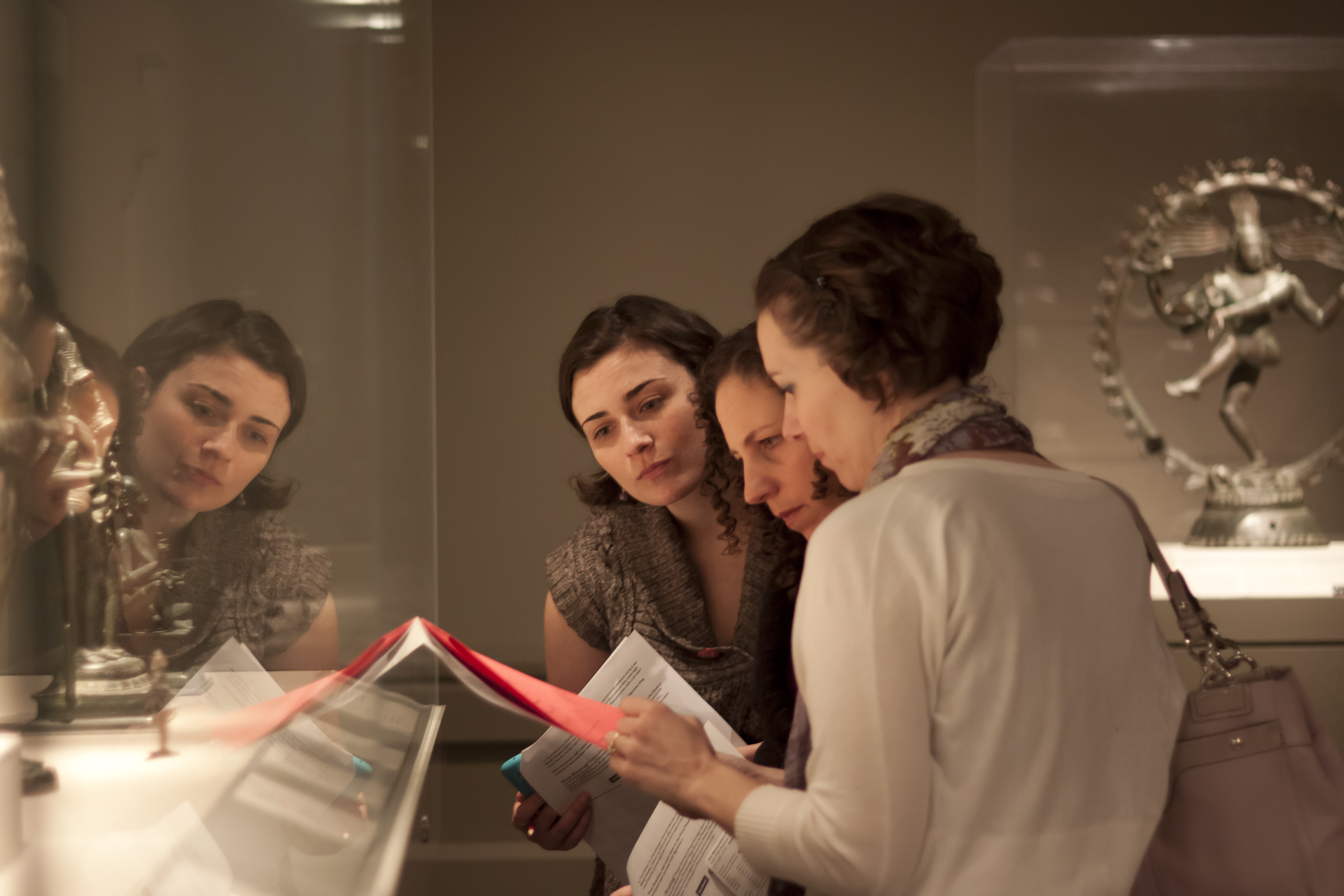 Teammates look for clues on a museum hunt.